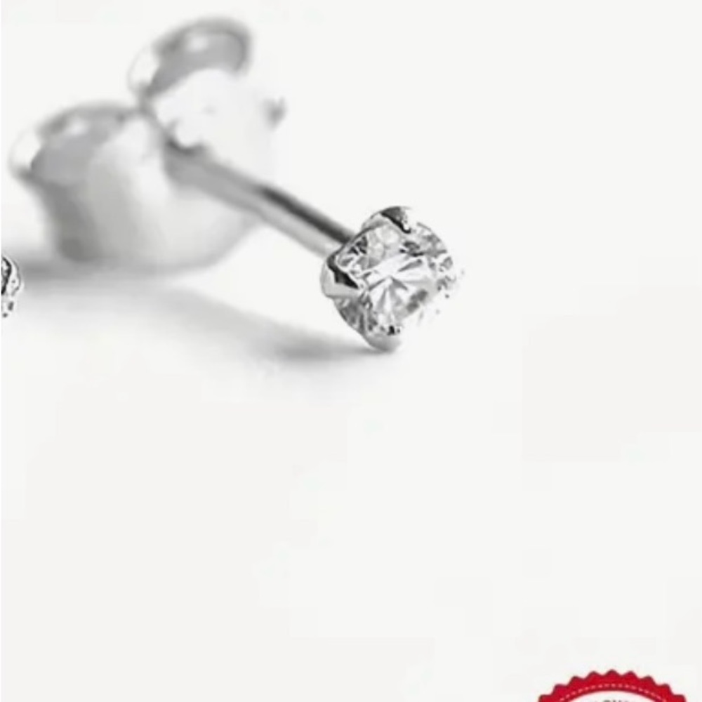 See PhotosSingleDiamond earring 03. Set in Sterling silver. This is only 1 stud.
